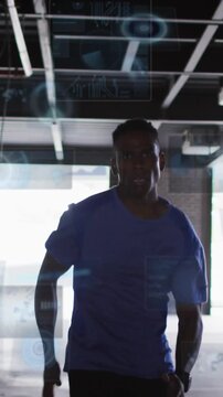 Vertical video: Male runner running from bright gap toward camera while HUD displaying fitness data