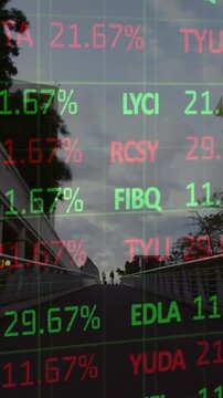 Vertical video: Group walking ramp, tickers updating market values, overlay obscuring figures