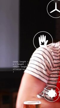 Vertical video: Striped man reacting to offscreen sports, gesturing, supporting team, icons overlay