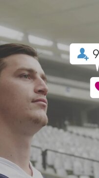 Vertical video: Athlete in stadium, incoming bubbles piling over face, donning headguard for match