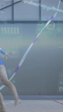 Vertical video: Gymnast bending, launching into split leap, ribbon unfurling across HUD for scoring