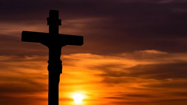 A powerful silhouette of a crucifix stands against a stunning, colorful sunset, evoking deep spiritual meaning and reflection.