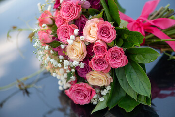Bridal Rose Bouquet on Reflective Surface