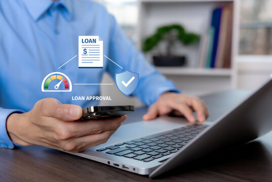 Businessman using smartphone and laptop with digital loan approval interface, credit assessment, secure application process, and online lending service in a modern workspace.