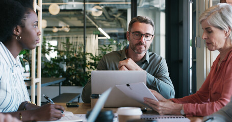 Man, team and laptop with documents in meeting for manuscript revision, news planning and feedback....