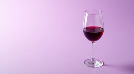 Glass of wine sitting on a table drink background