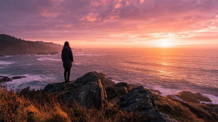 Fototapeta premium Peaceful evening moment: a person facing the sunset, expansive sky and golden light