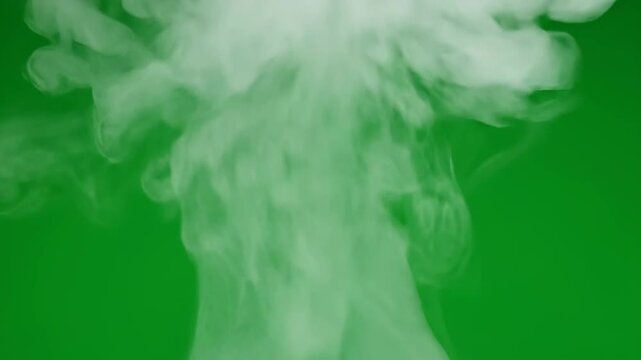 Realistic white smoke or steam effect rising and swirling, isolated on a chroma key green screen background. Ideal for visual effects, overlays, and compositing projects.