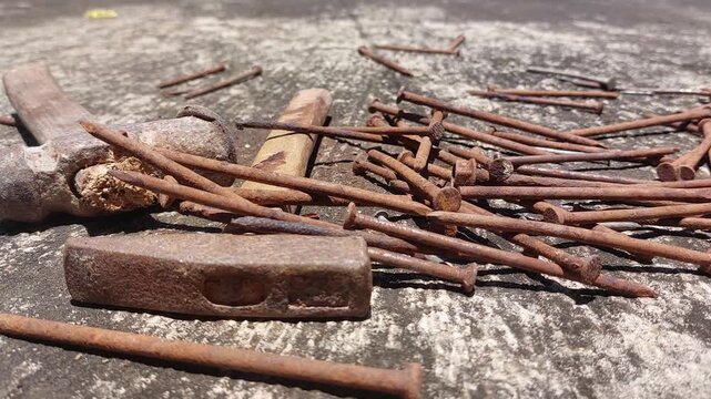 footage of many old rusty nails showing corrosion and decay caused by the oxidation process. 