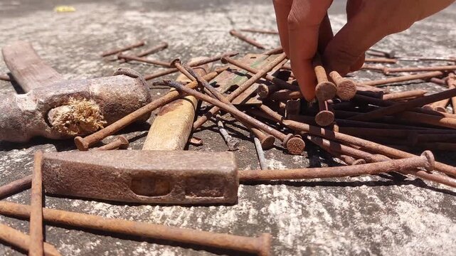footage of many old rusty nails showing corrosion and decay caused by the oxidation process. 