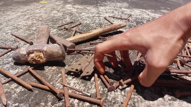 footage of many old rusty nails showing corrosion and decay caused by the oxidation process. 
