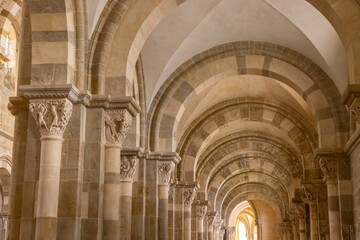 Naklejka premium Vezelay Basilica aisle showing Romanesque architecture and carved capitals