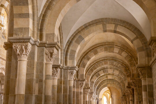 Vezelay Basilica aisle showing Romanesque architecture and carved capitals