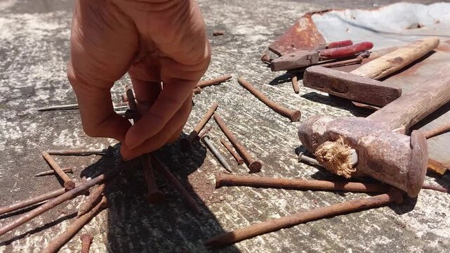 footage of many old rusty nails showing corrosion and decay caused by the oxidation process. 