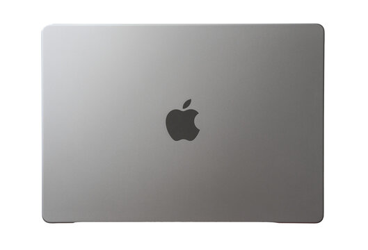 Top view of a modern silver Apple MacBook laptop computer closed and isolated on a clean white background.