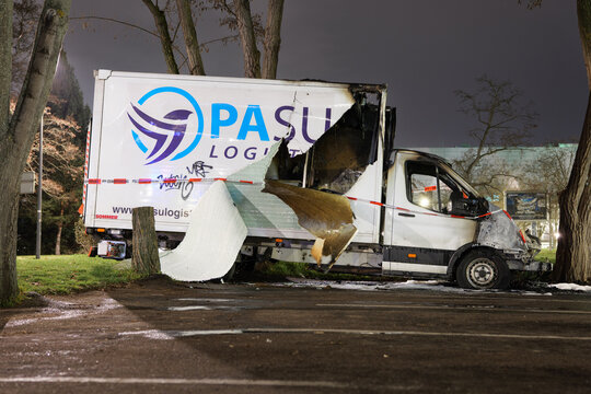 DRESDEN, GERMANY - 12. March 2026: PaSu Logistic van burned out at night. It is located on the parking lot Reitbahnstrasse within the city. Destroyed vehicle with barrier tape of the police.