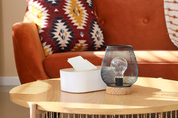 Lamp with tissue box on table in living room