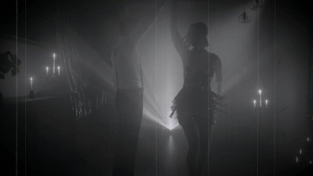 1920s old style black and white color silhouette romantic happy couple dancing together in dark night club. woman flapper with man have fun at dance floor retro party, roaring twenties looped video.