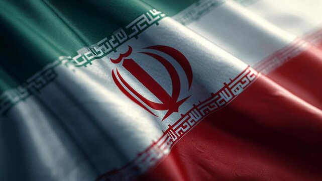 Close-up of the national flag of Iran waving in the wind with vibrant colors.
