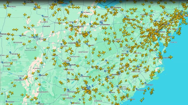 Air traffic density map showing active flights over eastern United States, Aircraft positions visualized on navigation display illustrating aviation movement