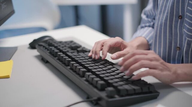 Close-up hand typing keyboard laptop programmer developer software engineer coding online monitor, remote work from home freelance concept