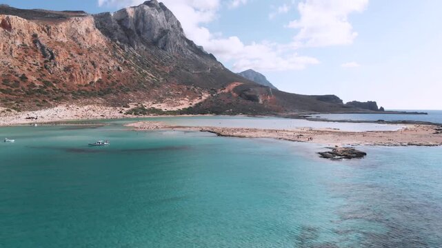 Aerial drone flight around Balos Lagoon with turquoise water in Crete, Greece