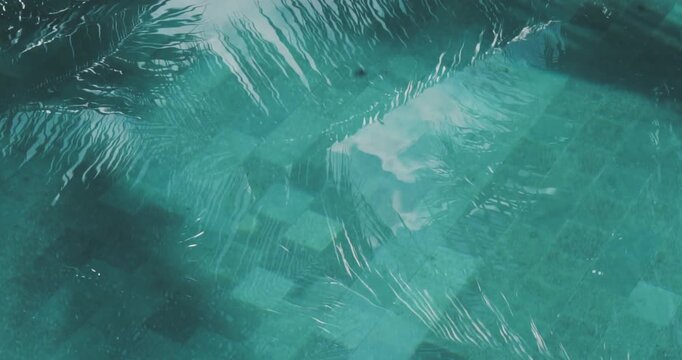 An artistic blue watercolor pattern of an underwater world map viewed through deep ocean waves and sunlight textures in a swimming pool design