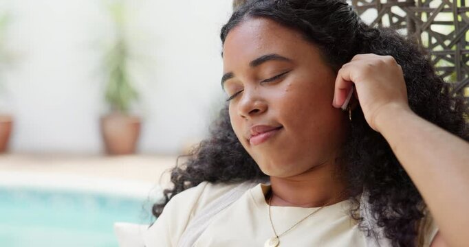 Woman, relax and earpods outdoor with music, streaming radio and online playlist on weekend break. Female person, chill and audio tech in backyard with song, wellness and listening to album at home.