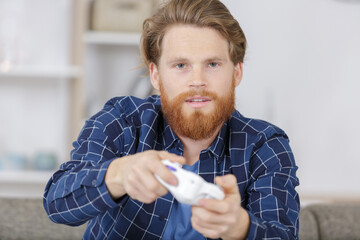man playing video game retro gamepad console © auremar