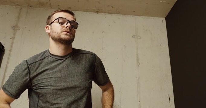 a worried man waiting inside a bunker shelter during a dangerous situation. Concept of war anxiety, civilian protection, emergency shelter, and stress during conflict.