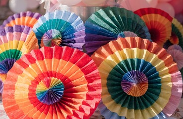 Fototapeta premium Rainbow Pride Paper Fan Decor Close Up for Pride Festival
