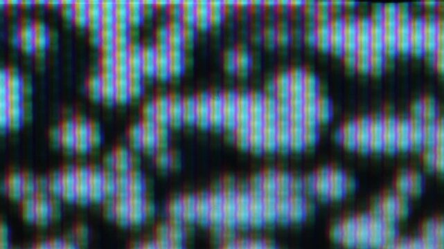 Analog TV screen close-up with the individual red, green, and blue pixels that
