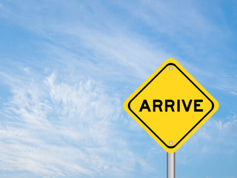 Yellow transportation sign with word arrive on blue color sky background