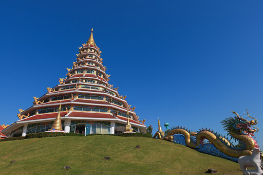 Chiang Rai, Thailand - November 29 2025 : External view of the Phop Chok Dhamma Chedi, a 9-storey pagoda at Wat Huay Pla Kang, Chiang Rai, Thailand.