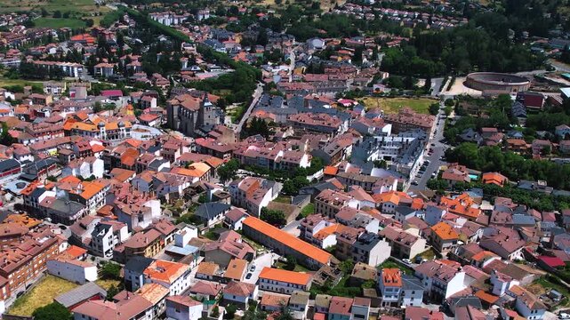 Aerial panorama view around the downtown of the city El Espinar  in Spain on a sunny summer noon.