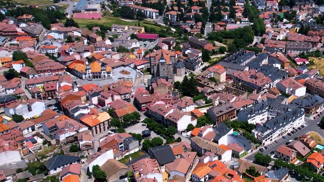 Aerial panorama view around the downtown of the city El Espinar  in Spain on a sunny summer noon.