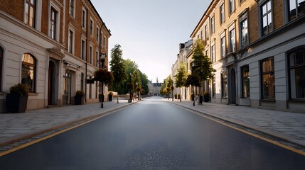 A sunlit empty European city street lined with historic buildings trees and paved sidewalks