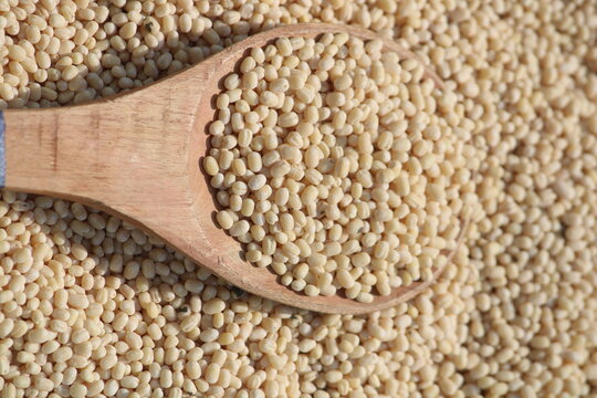 split urad dal also known as white urad dal or white gram Urad dal is a type of lentil derived from black gram beans . split urad dal on wooden spoon