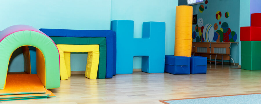 Interior of a recreation and rehabilitation center with soft, colorful play elements. Creating a stimulating environment for child development