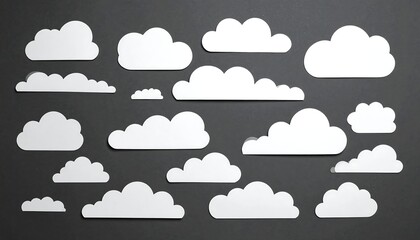 Obraz premium White Cloud Cutouts on a Dark Background - A Simple and Elegant Design.