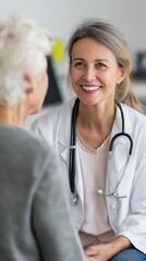 Caucasian female doctor smiling in consultation with elderly caucasian patient in medical office