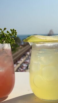 Assortment of five colorful tropical cocktails at a luxury resort in Egypt. Variety of refreshing summer drinks with exotic garnish on a sunny poolside terrace.