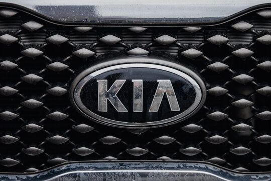 KIA logo badge on the front of a car