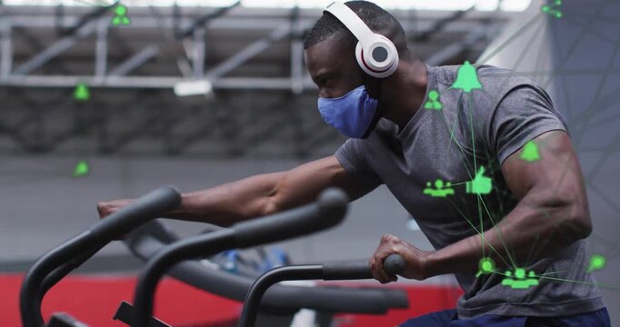 Animation of network of connections with icons over african american man at gym