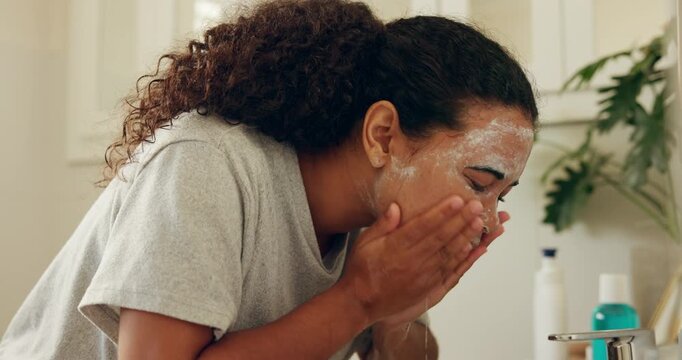 Face wash, water and woman in bathroom for skincare, beauty or wellness routine in morning. Health, cosmetics and female person with splash for facial cleaning with dermatology treatment in apartment