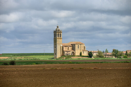 Santa Maria Arbis Church in Baquerin de Campos seen from surrounding farmlands