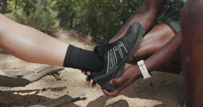 People, shoe and help with hiking injury for sprain, muscle tension or pain on outdoor trail. Active, sneaker or sore ankle with movement or joint inflammation for strain or trekking accident on path