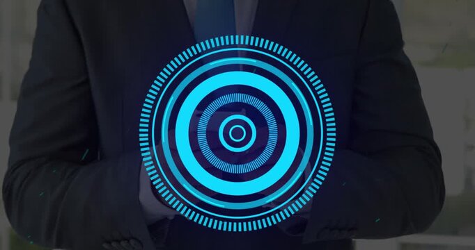 Animation of processing circle over hands of caucasisn man using smartphone