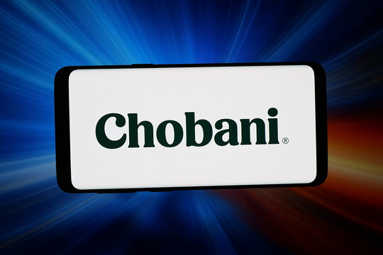 Stuttgart, Germany - 03-09-2026: In this photo illustration, the logo of US strained yogurt company Chobani LLC is displayed on a smartphone in front of abstract background on computer screen.