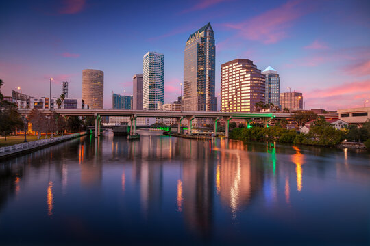 Tampa, Florida, USA. Cityscape image of Tampa, Florida with reflection of the city skyline in the water at beautiful sunset.